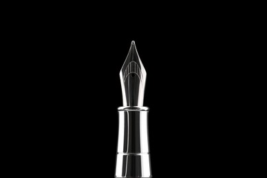 Photo of Stylish silver fountain pen on black background, closeup