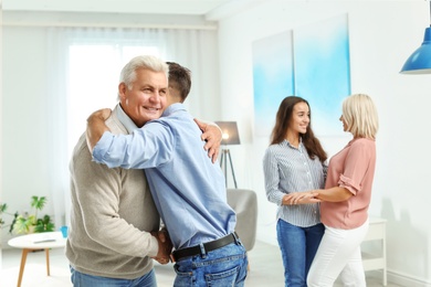 Happy family at home. Reunion of generations