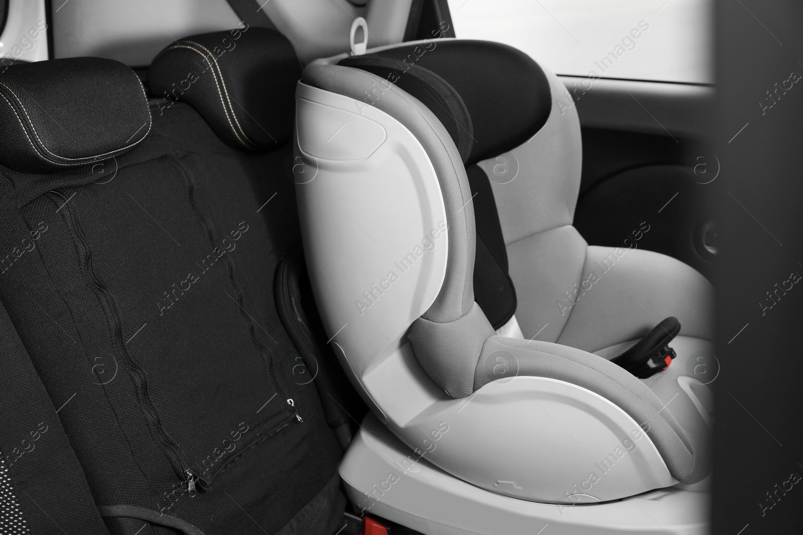 Photo of Empty baby seat inside car. Child safety