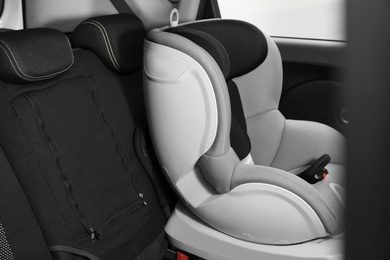 Empty baby seat inside car. Child safety