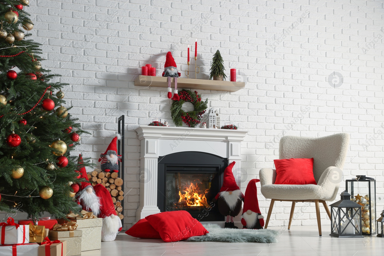 Photo of Beautiful Christmas themed photo zone with tree and fireplace in room