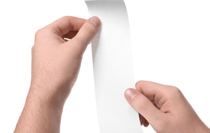 Man holding piece of blank thermal paper for receipt on white background, closeup