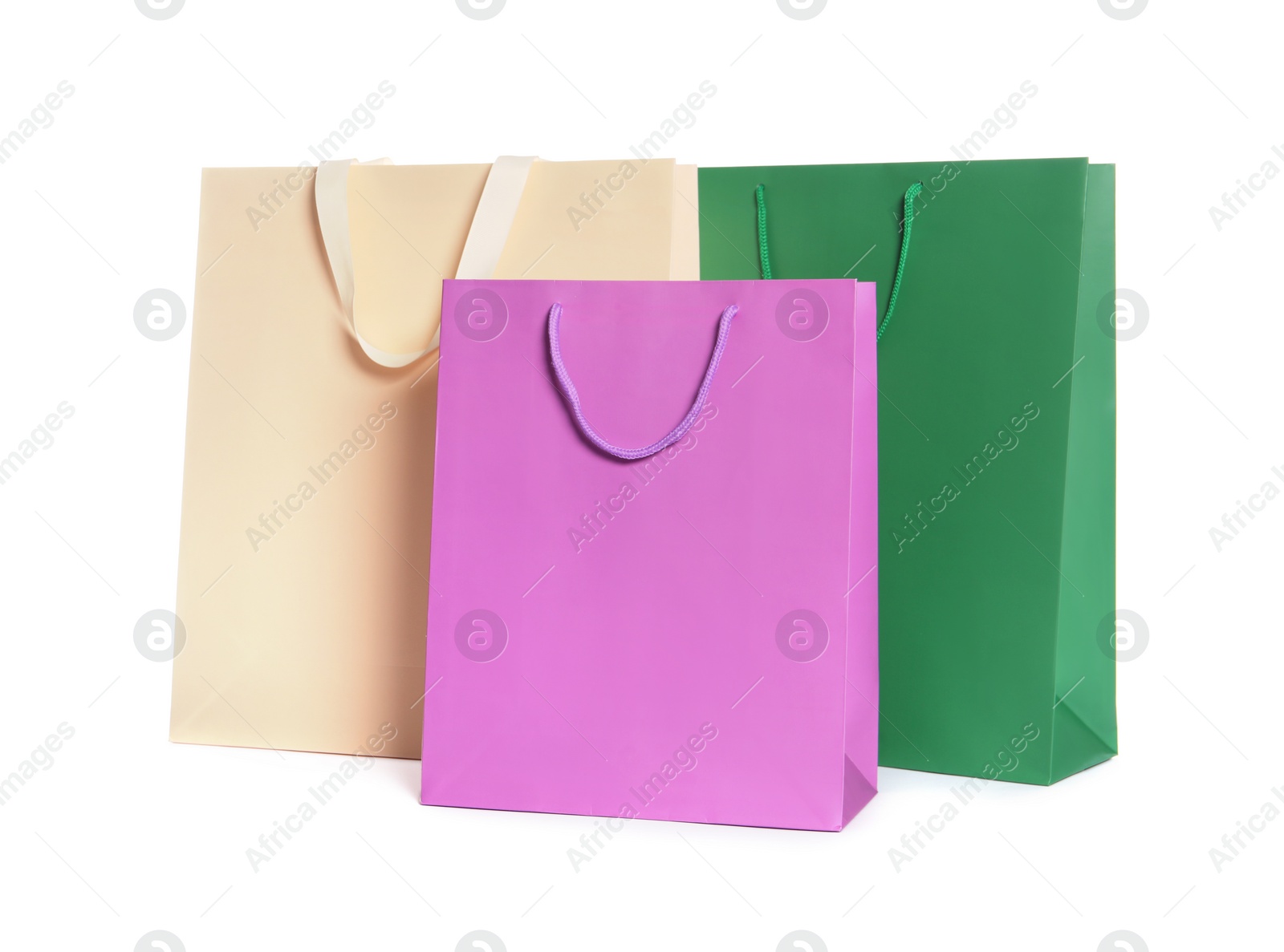 Photo of Colorful paper shopping bags isolated on white