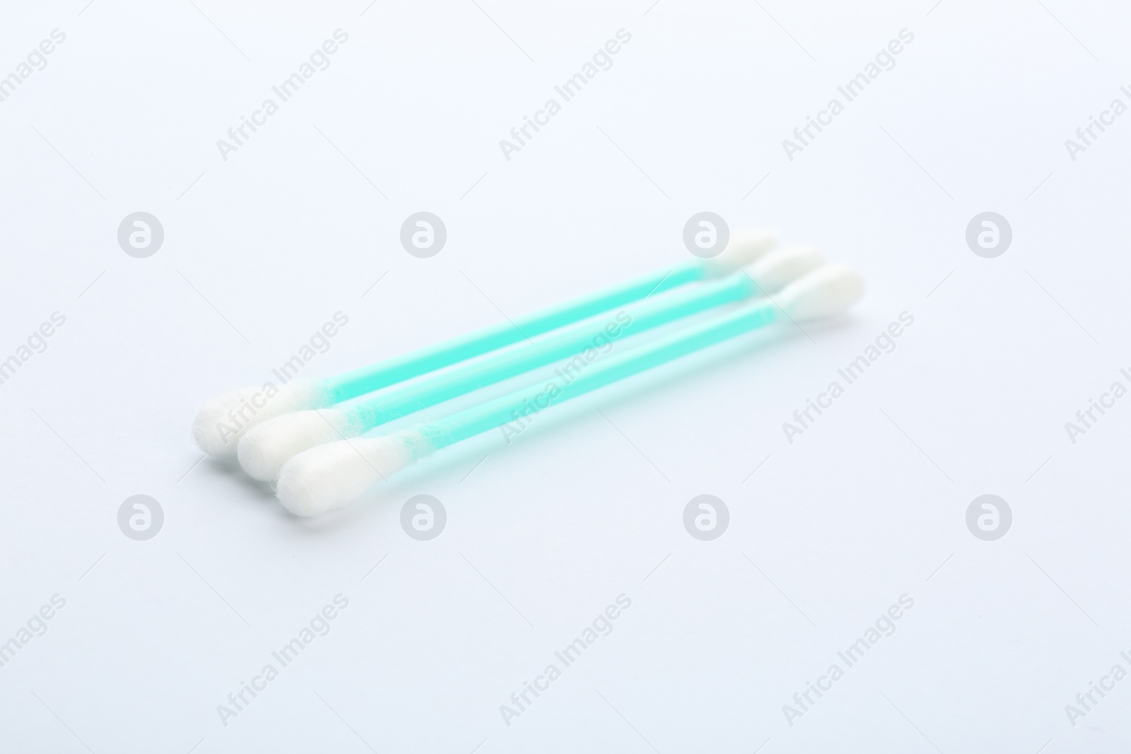 Photo of Plastic cotton swabs on white background. Hygienic accessory