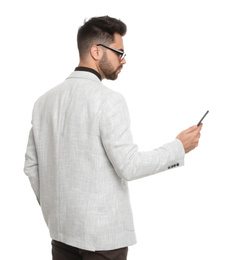 Young businessman with smartphone on white background