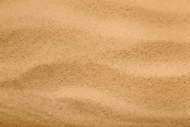 Photo of Dry sand on beach as background, closeup