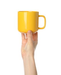 Photo of Woman holding yellow cup on white background, closeup