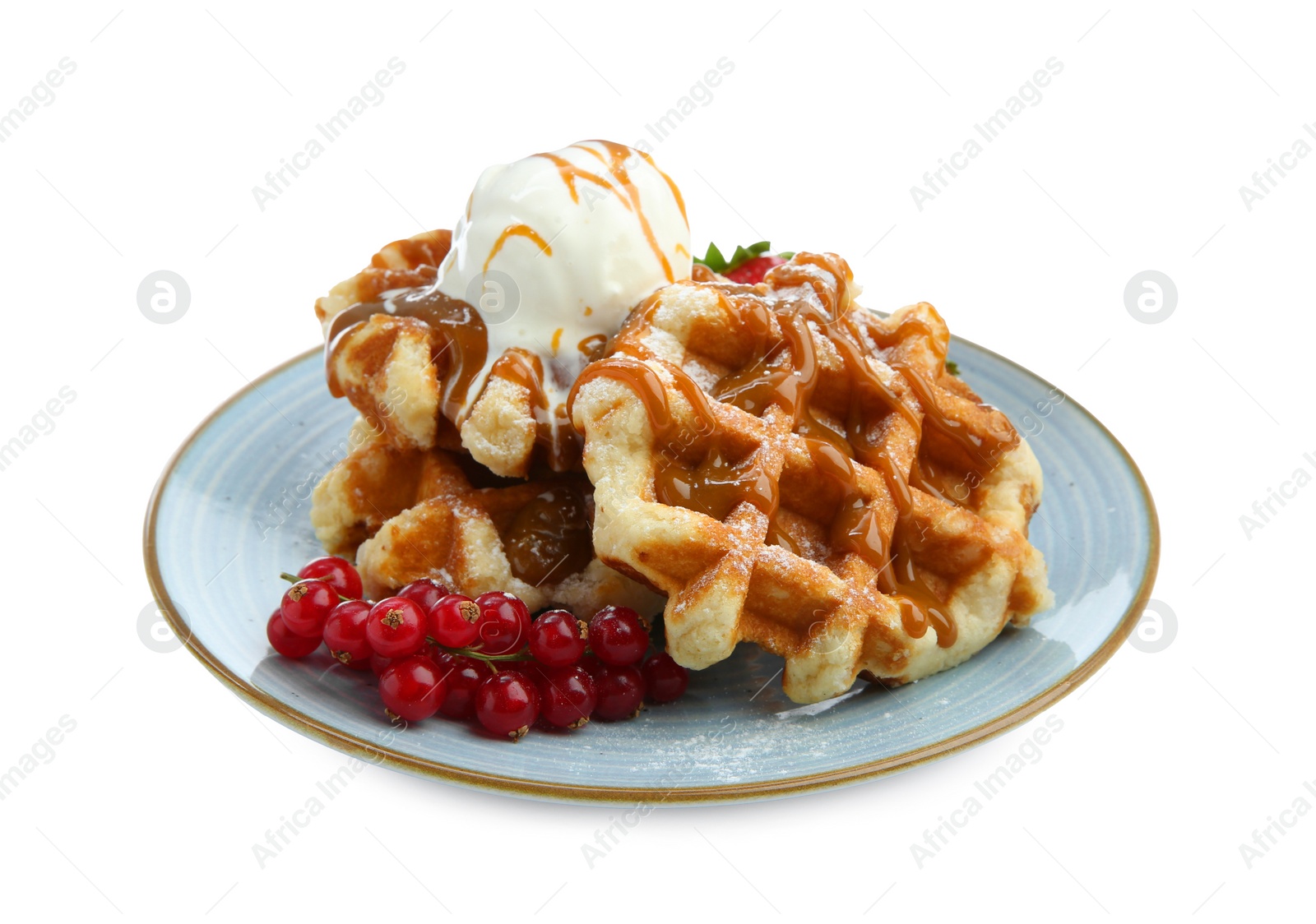 Photo of Tasty Belgian waffles with ice cream, red currants and caramel syrup on white background