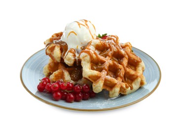 Photo of Tasty Belgian waffles with ice cream, red currants and caramel syrup on white background