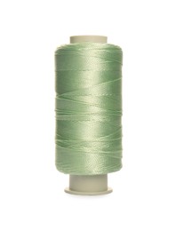 Spool of light green sewing thread isolated on white