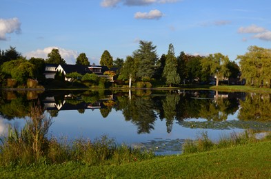 Photo of Picturesque view of pond and beautiful estate