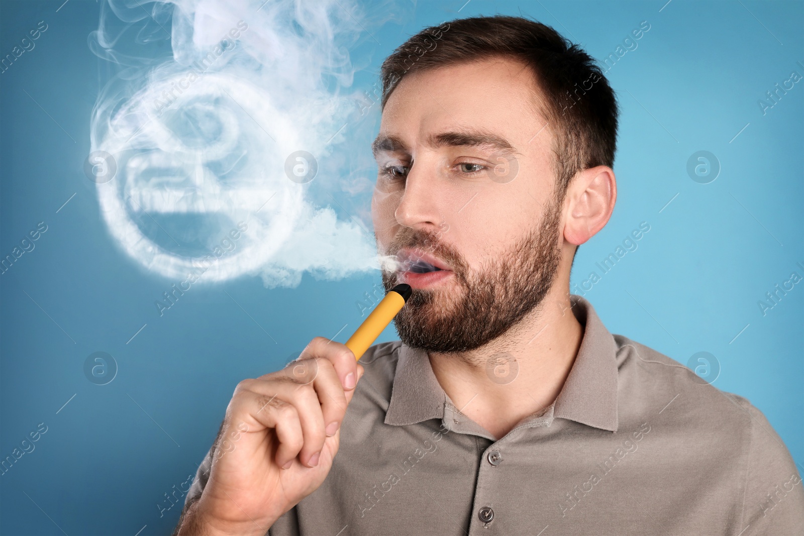 Image of No Smoking. Man using electronic device on light blue background. Round sign with crossed cigarette of smoke