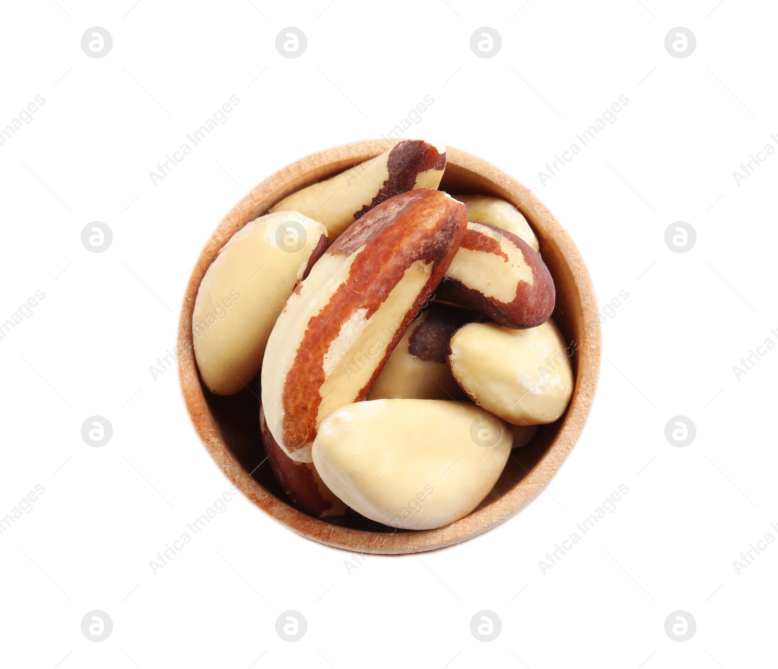 Photo of Wooden bowl with Brazil nuts on white background, top view