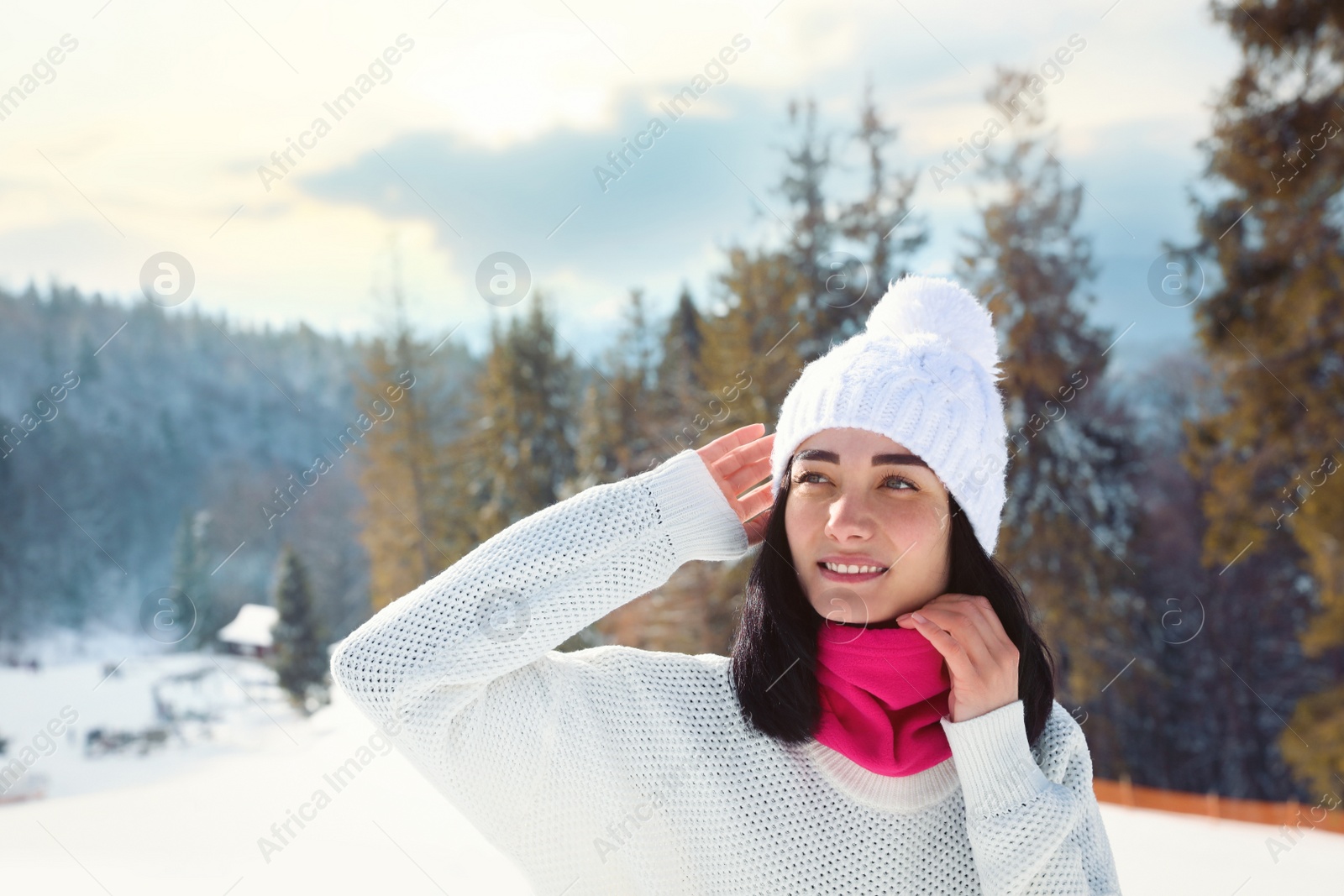 Photo of Young woman at mountain resort. Winter vacation