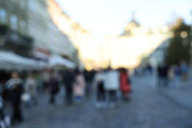 Blurred view of people walking on city street