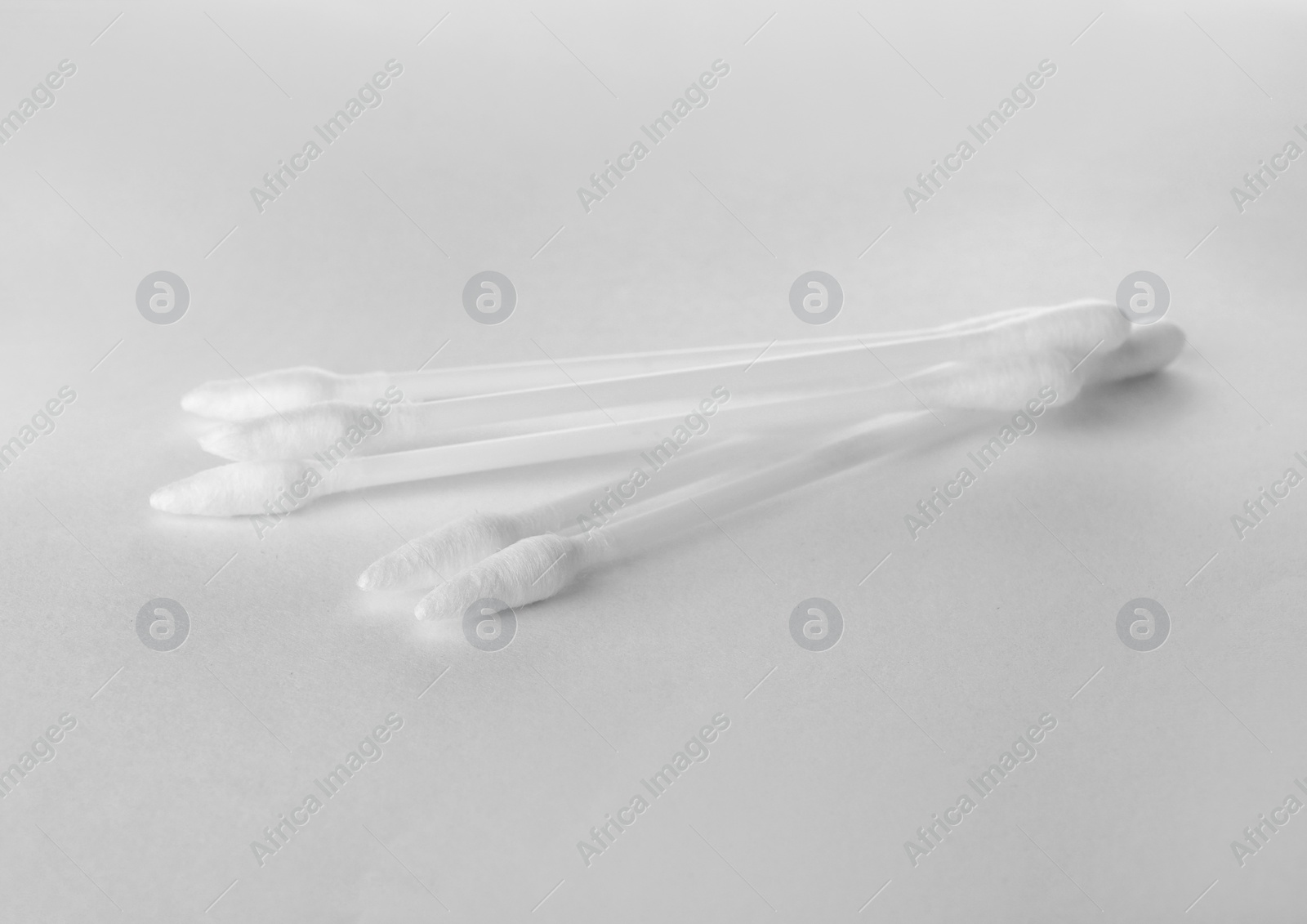 Photo of Clean cotton buds isolated on white. Hygienic product