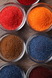 Many different food coloring on wooden table, flat lay