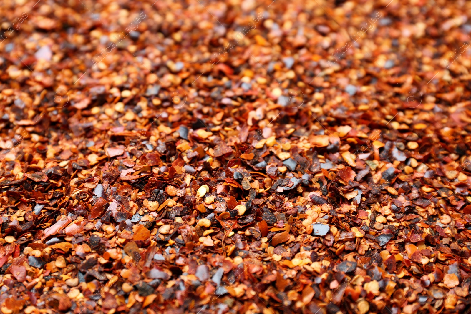 Photo of Crushed chili pepper as background