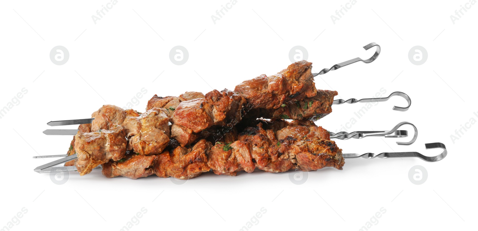 Photo of Metal skewers with delicious meat on white background
