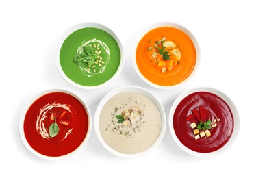Photo of Various soups in bowls on white background, top view. Healthy food