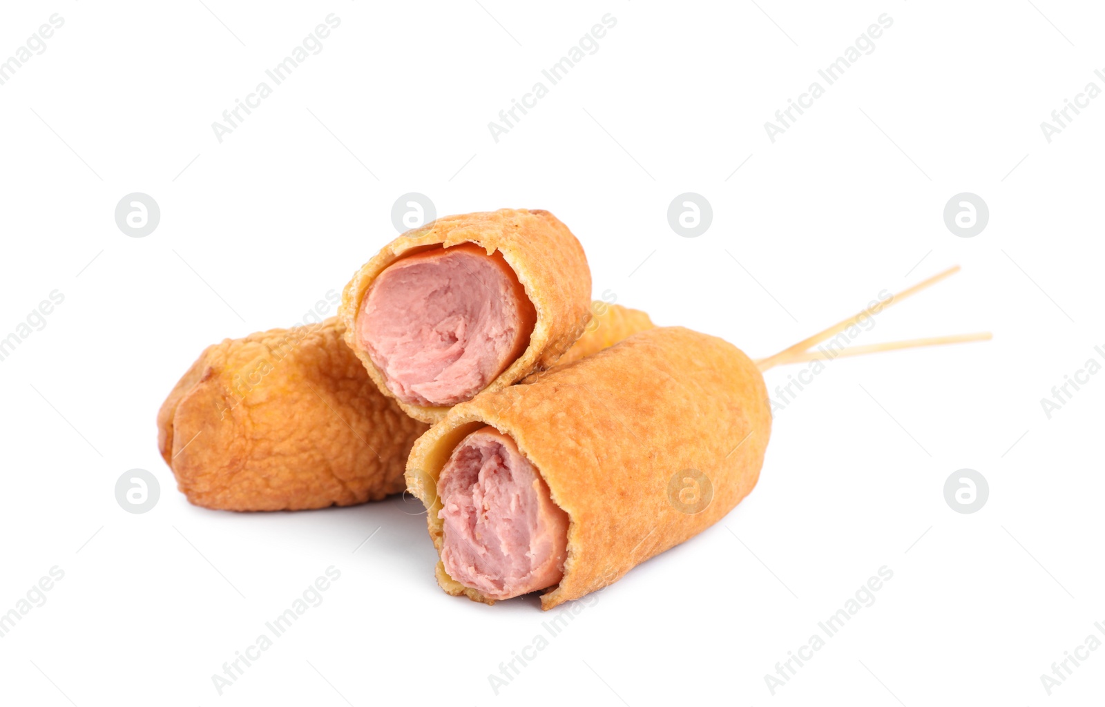 Photo of Delicious deep fried corn dogs on white background