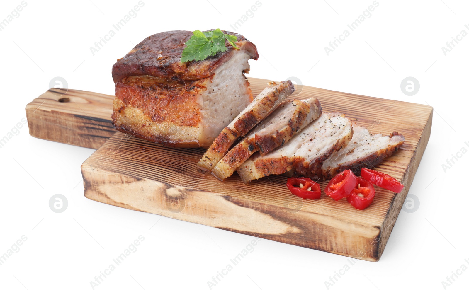 Photo of Pieces of tasty baked pork belly and chili pepper isolated on white