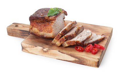 Photo of Pieces of tasty baked pork belly and chili pepper isolated on white