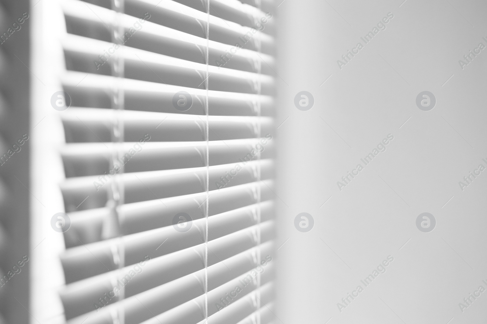 Photo of Closeup view of stylish horizontal window blinds