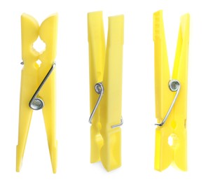 Set with yellow plastic clothespins on white background