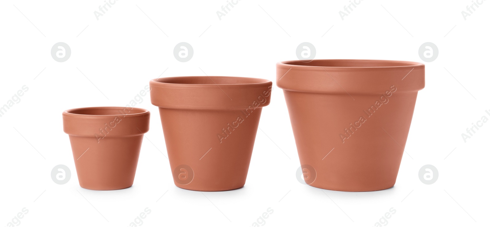 Photo of Stylish terracotta flower pots isolated on white