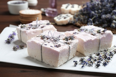 Photo of Hand made soap bars with lavender flowers on paper