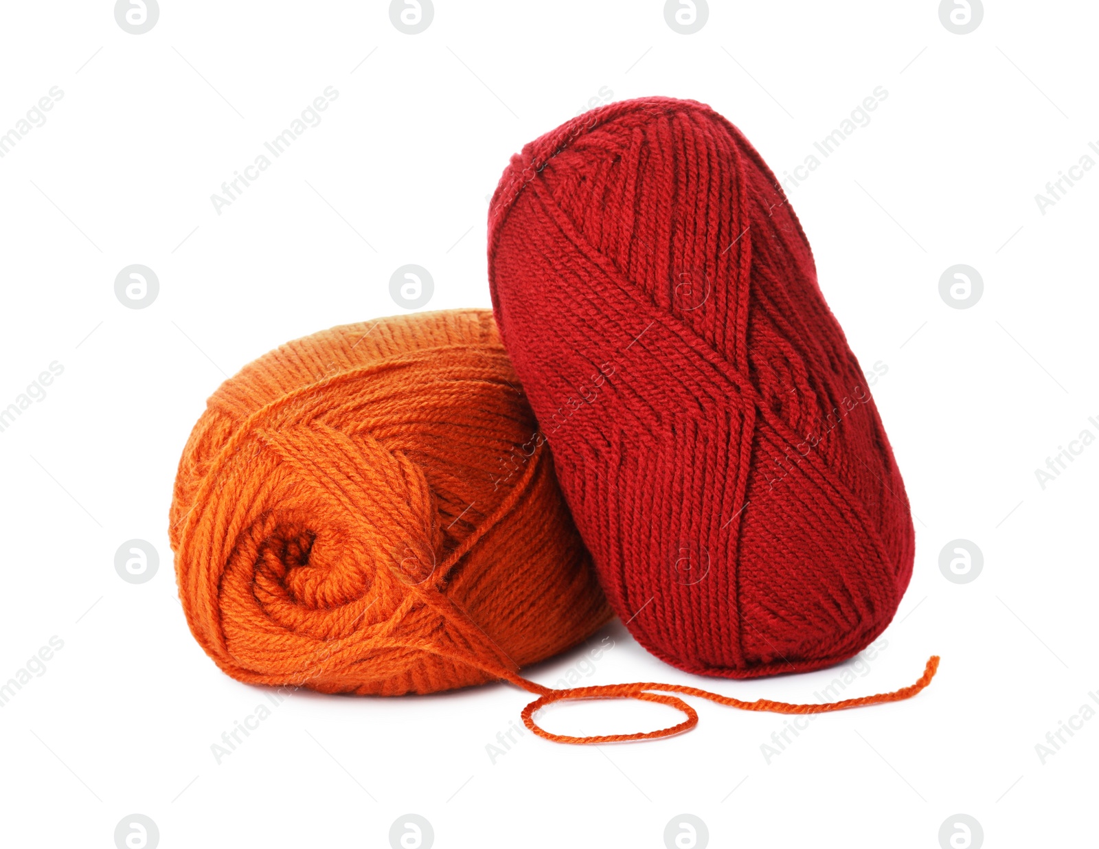 Photo of Soft colorful woolen yarns on white background