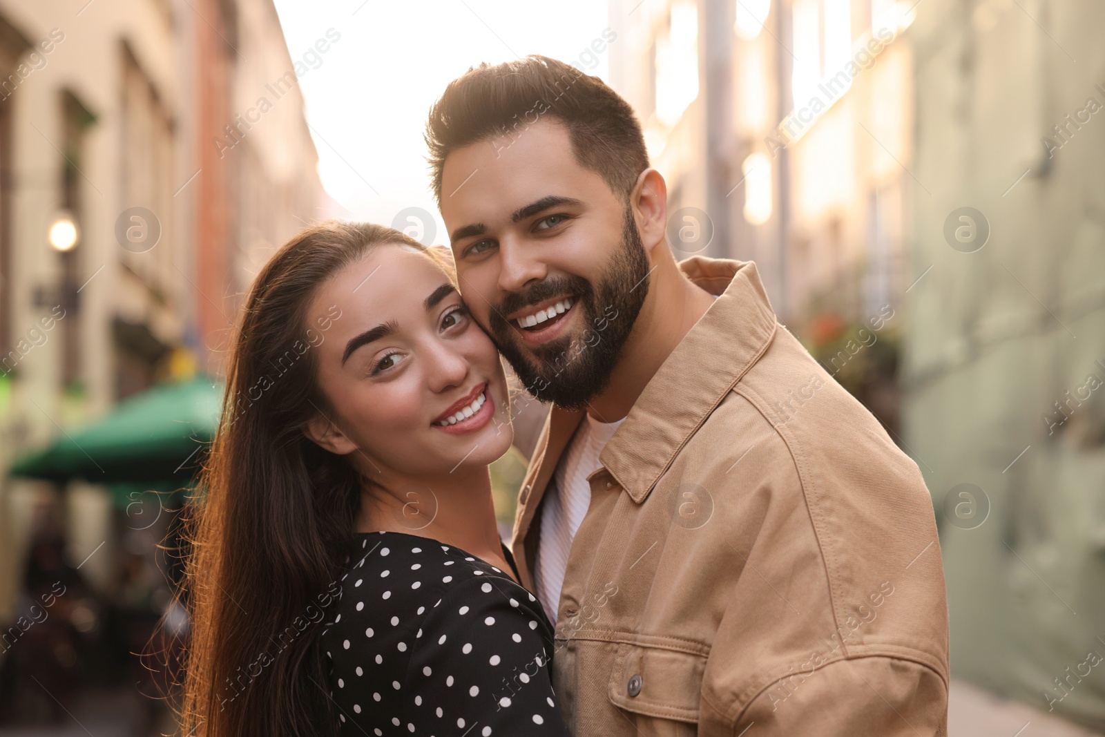 Photo of Lovely couple dancing together on city street