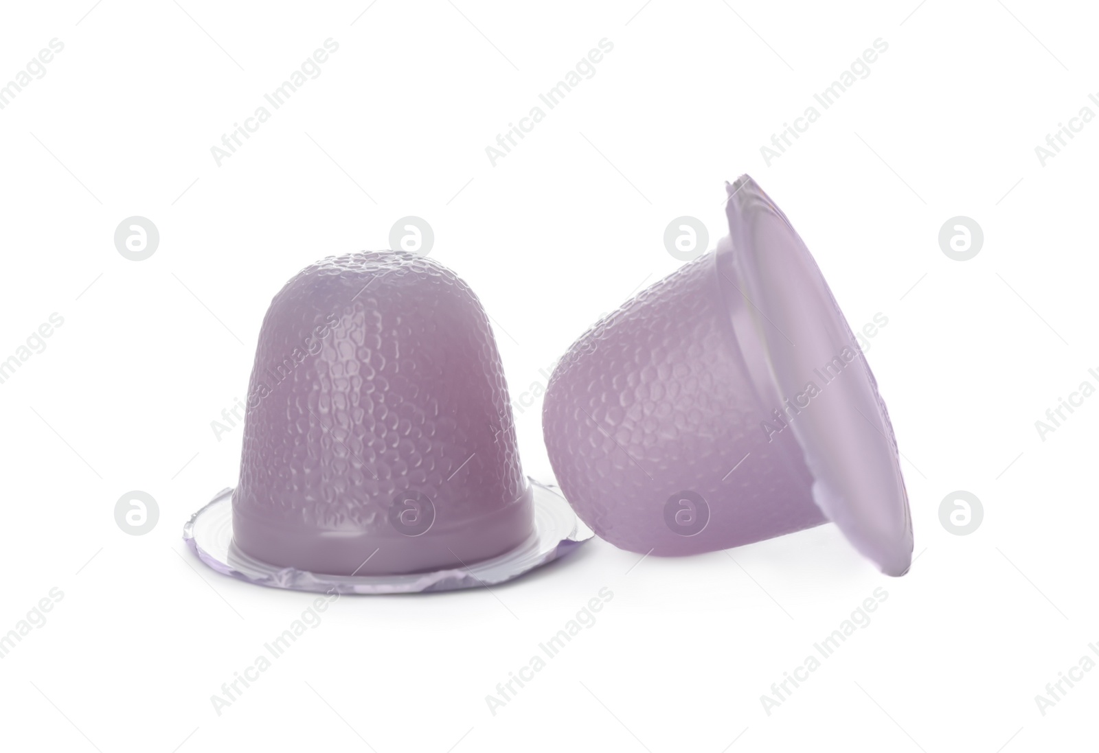 Photo of Delicious violet jelly cups on white background