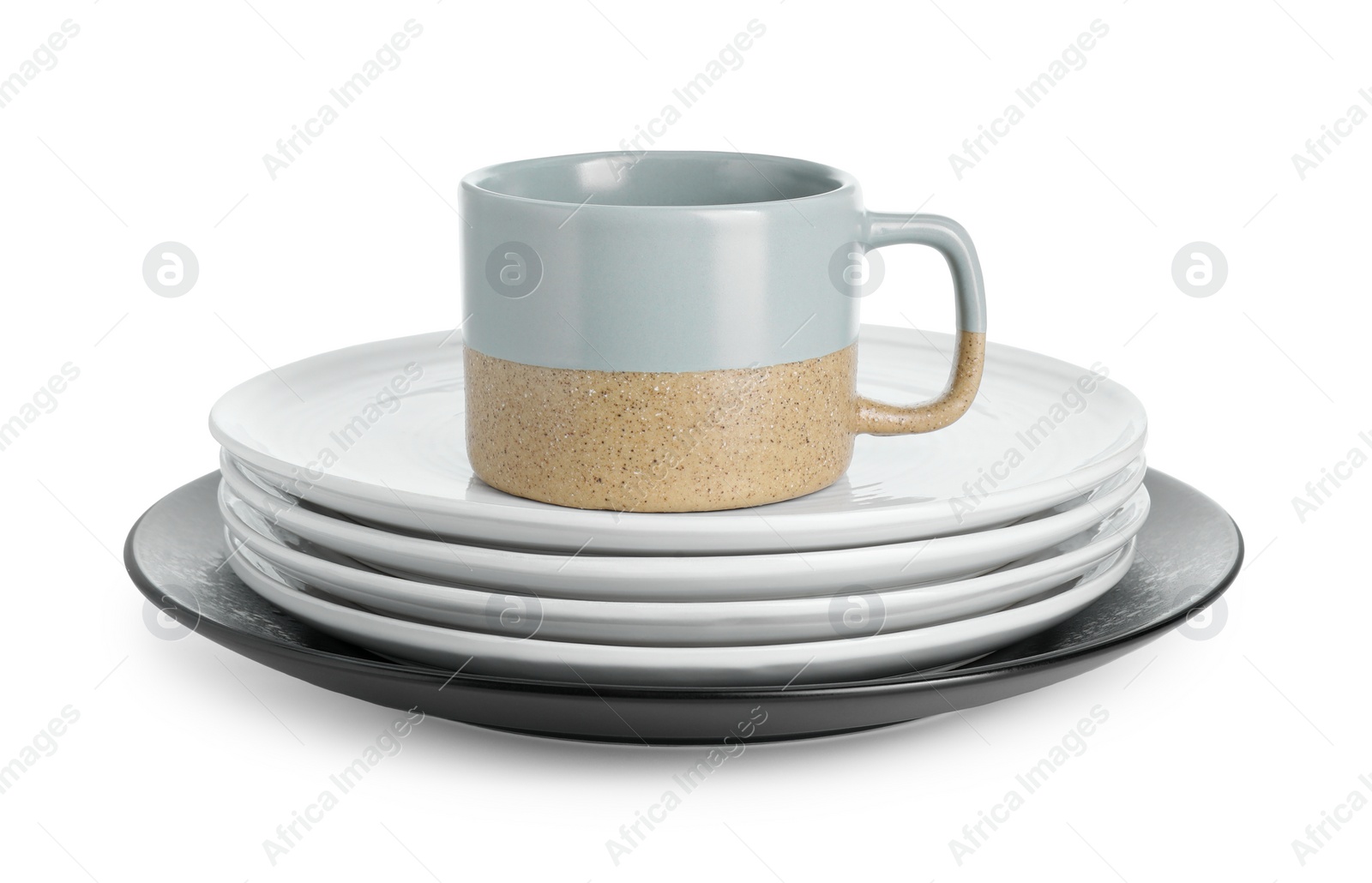 Photo of Beautiful ceramic plates and cup isolated on white