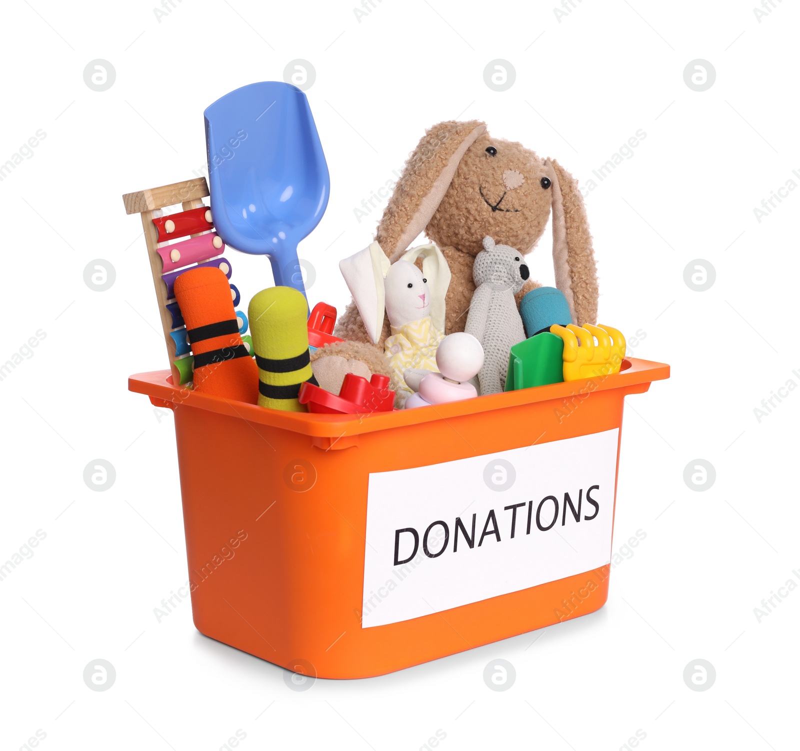 Photo of Donation box full of different toys isolated on white