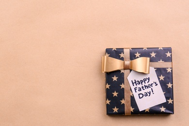 Photo of Gift box on color background. Father's day celebration