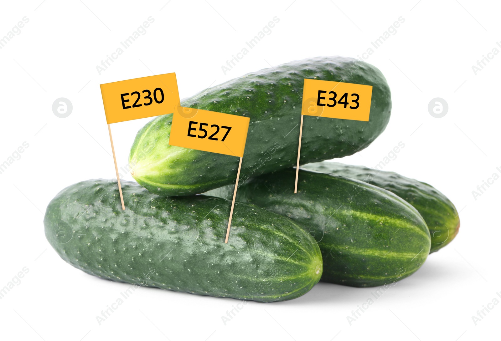 Image of Fresh cucumbers with E numbers on white background. Harmful food additives 