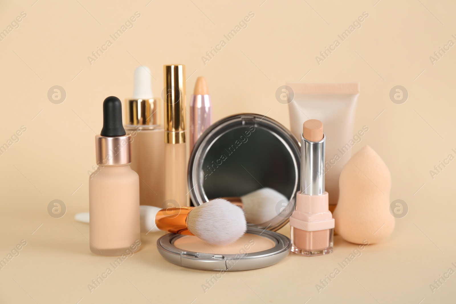 Photo of Foundation makeup products on beige background. Decorative cosmetics