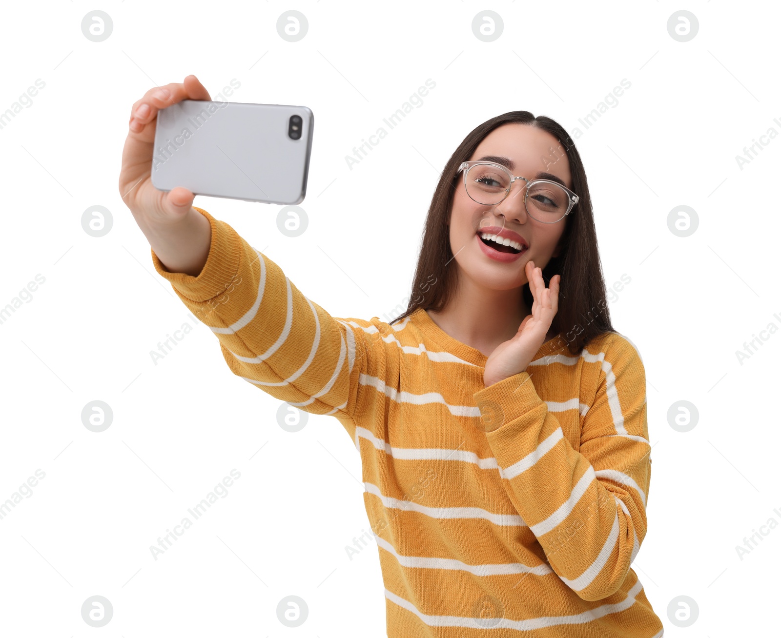 Photo of Smiling young woman taking selfie with smartphone on white background