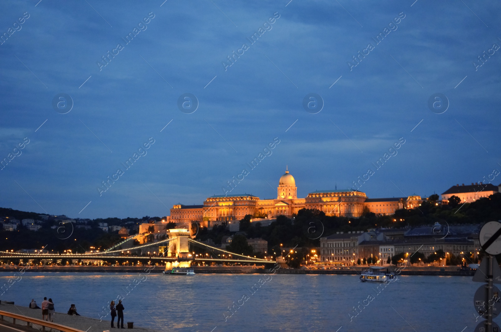 Photo of BUDAPEST, HUNGARY - JUNE 17, 2018: Picturesque view of Danube river, Chain Bridge and Royal Palace in evening