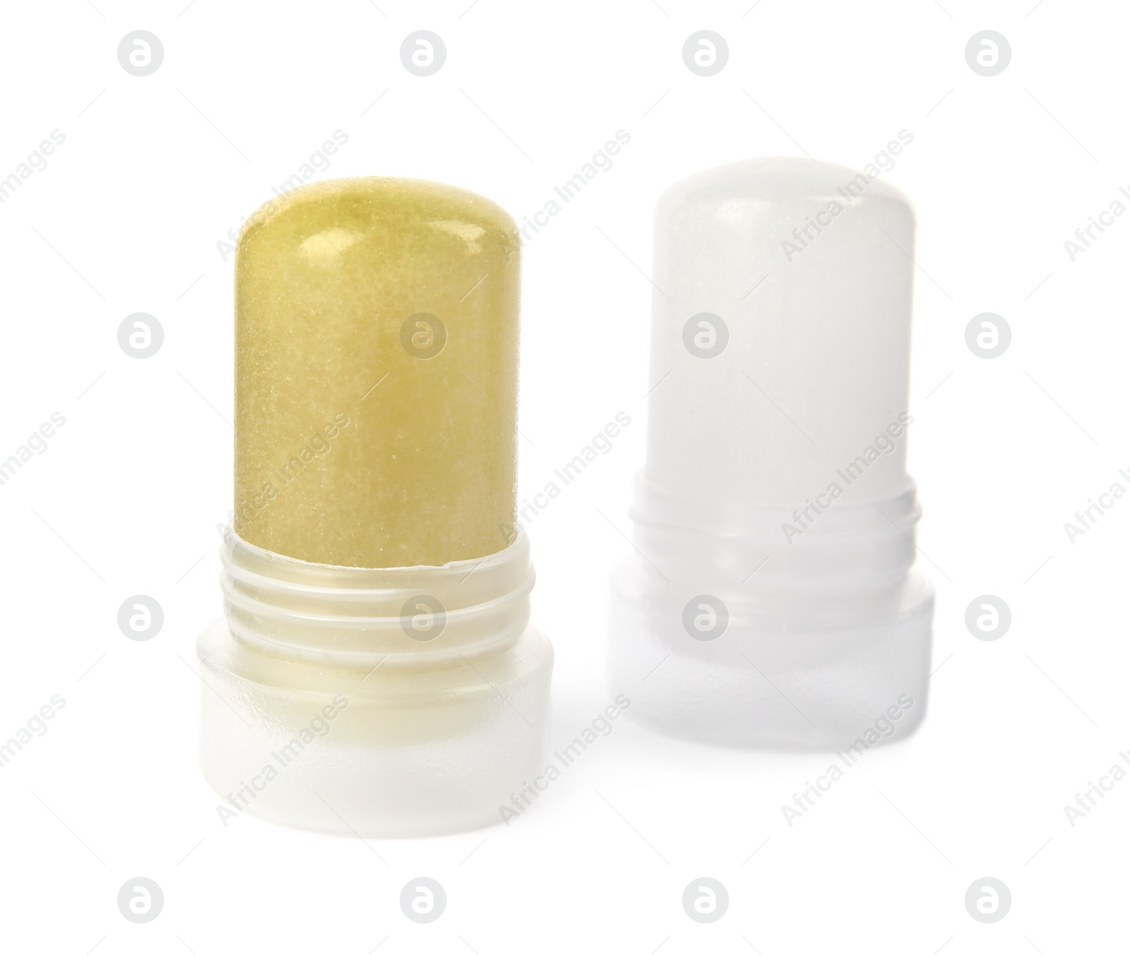 Photo of Natural crystal alum stick deodorants on white background