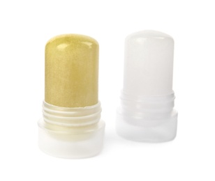 Photo of Natural crystal alum stick deodorants on white background