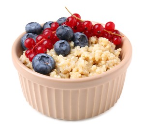 Bowl of delicious cooked quinoa with blueberries and cranberries isolated on white