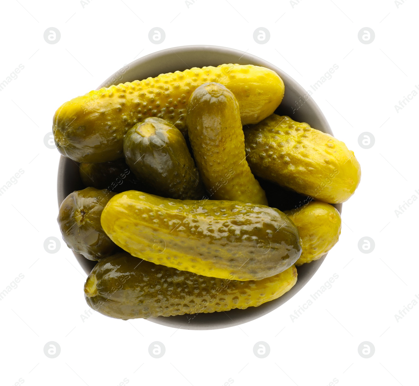 Photo of Bowl of tasty pickled cucumbers isolated on white, top view