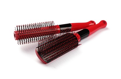 New modern hair brushes isolated on white