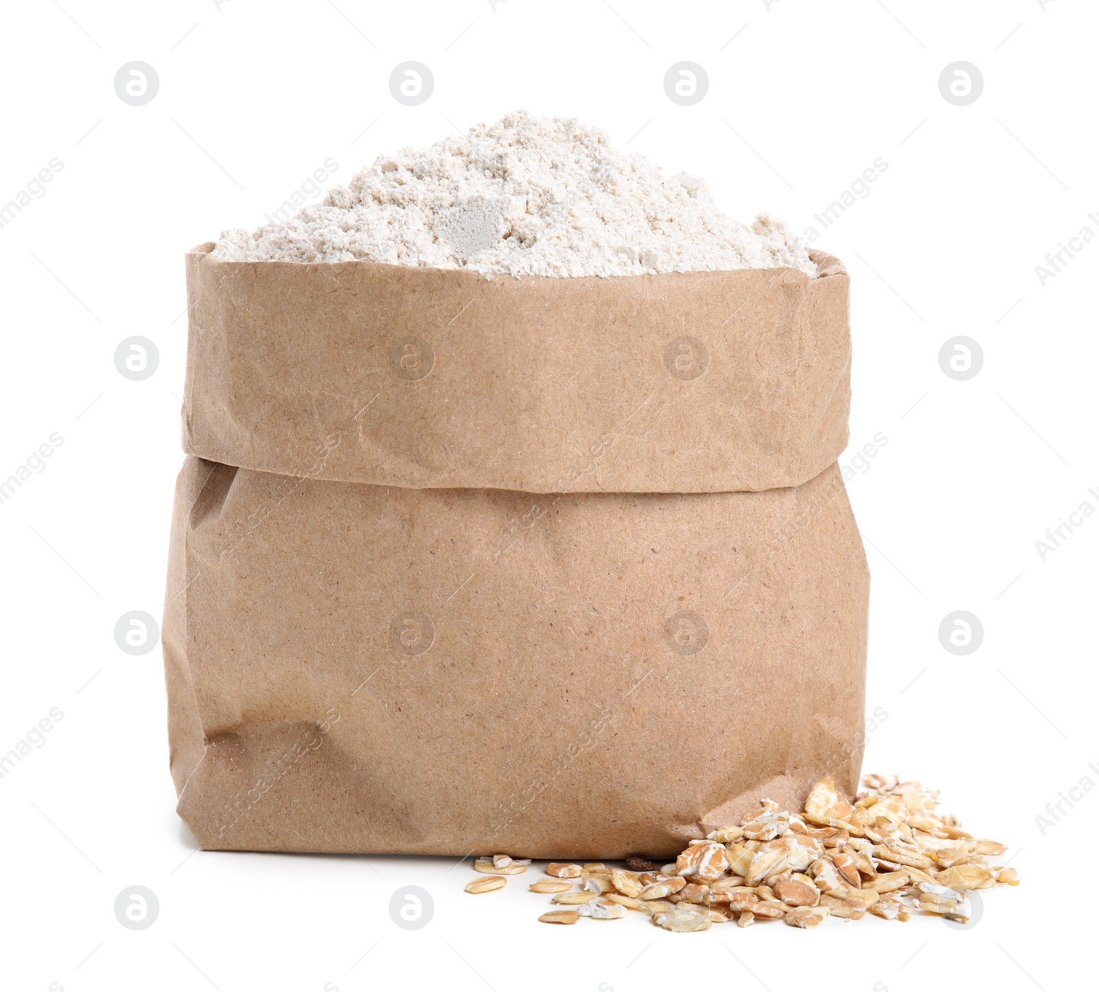 Photo of Paper bag with oatmeal flour and flakes isolated on white