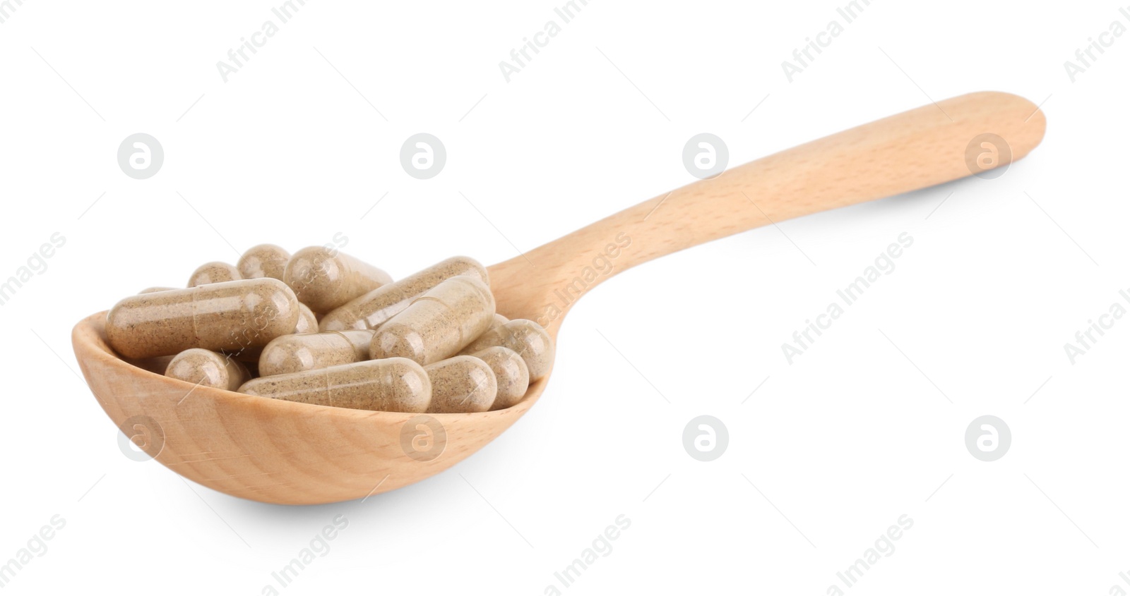 Photo of Vitamin capsules in wooden spoon isolated on white