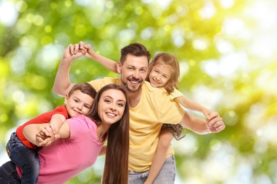 Image of Happy family with children outdoors on sunny day