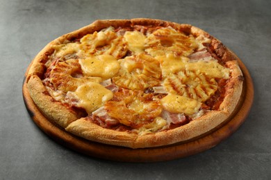 Delicious pineapple pizza on gray table, closeup